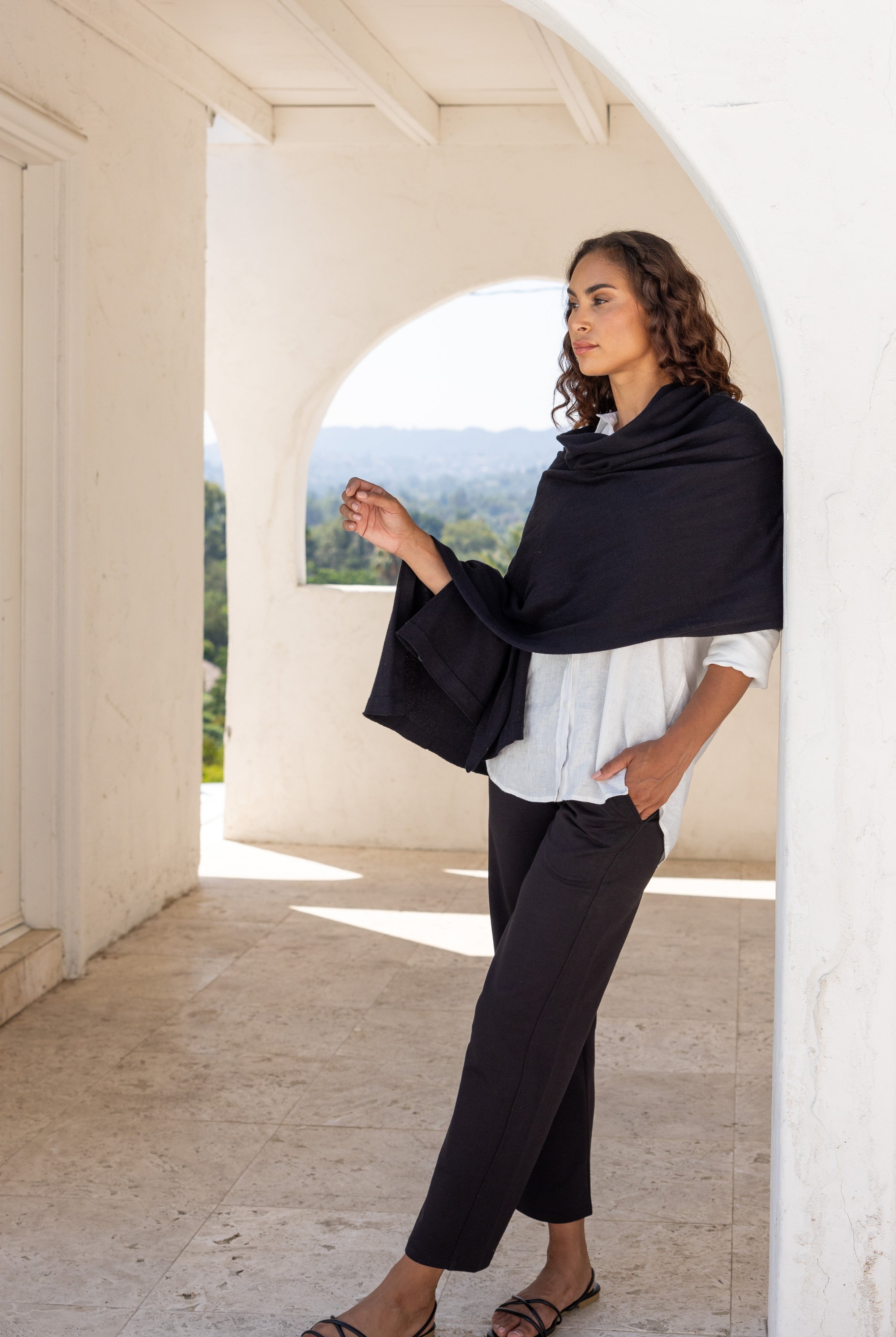 Woman wearing a Beige Scarf draped around her shoulders